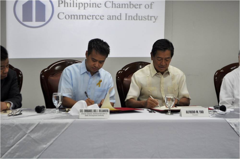 TESDA Director General Joel Villanueva and PCCI President Ambassador Alfredo Yao sign the Memorandum of Understanding for a public-private partnership in tech-voc training.
